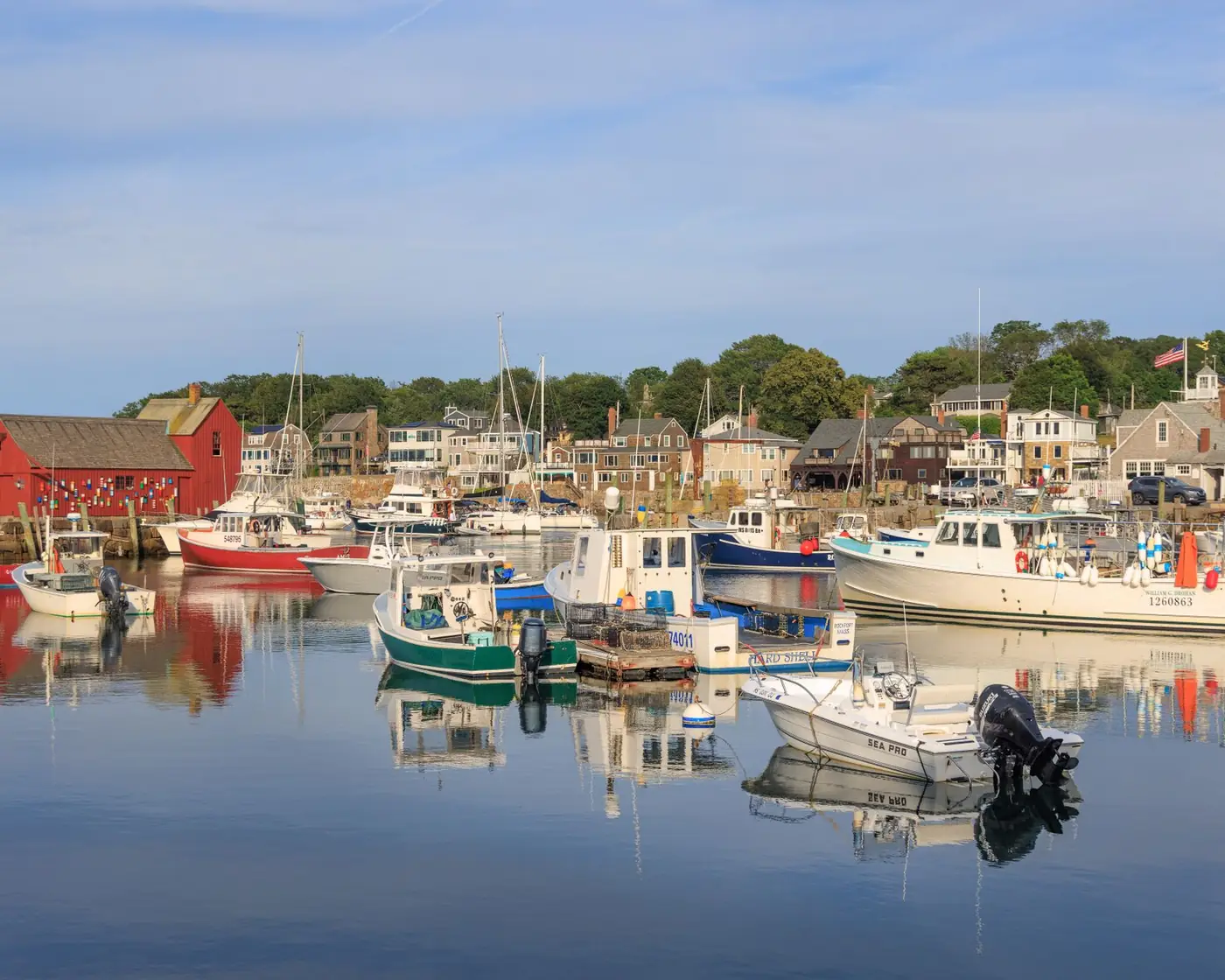 A New England harbour with fishing boats at their moorings.